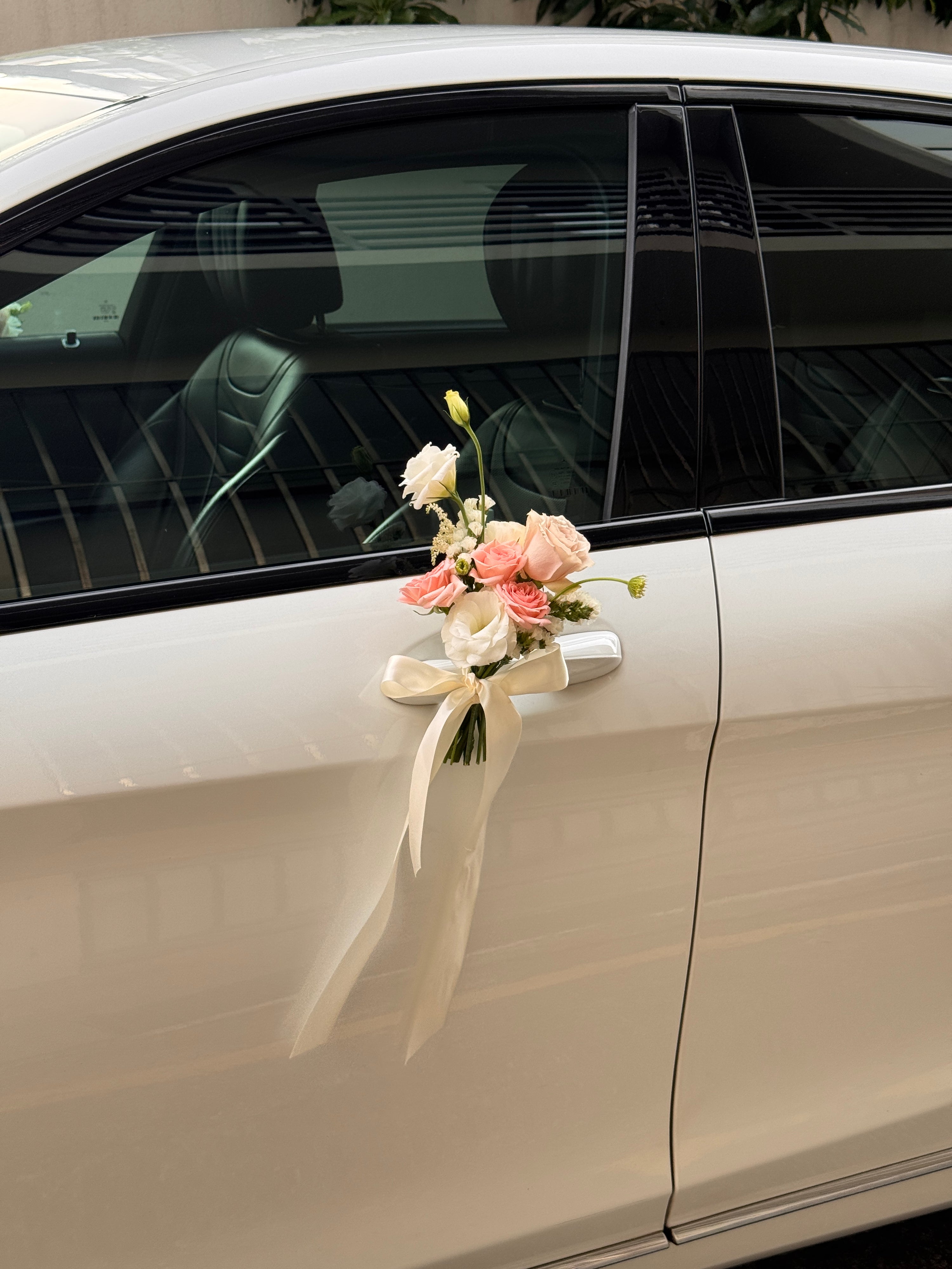 Wedding bridal car decor, craffted with fresh flowers by Eden's Ground, a floral design boutique.