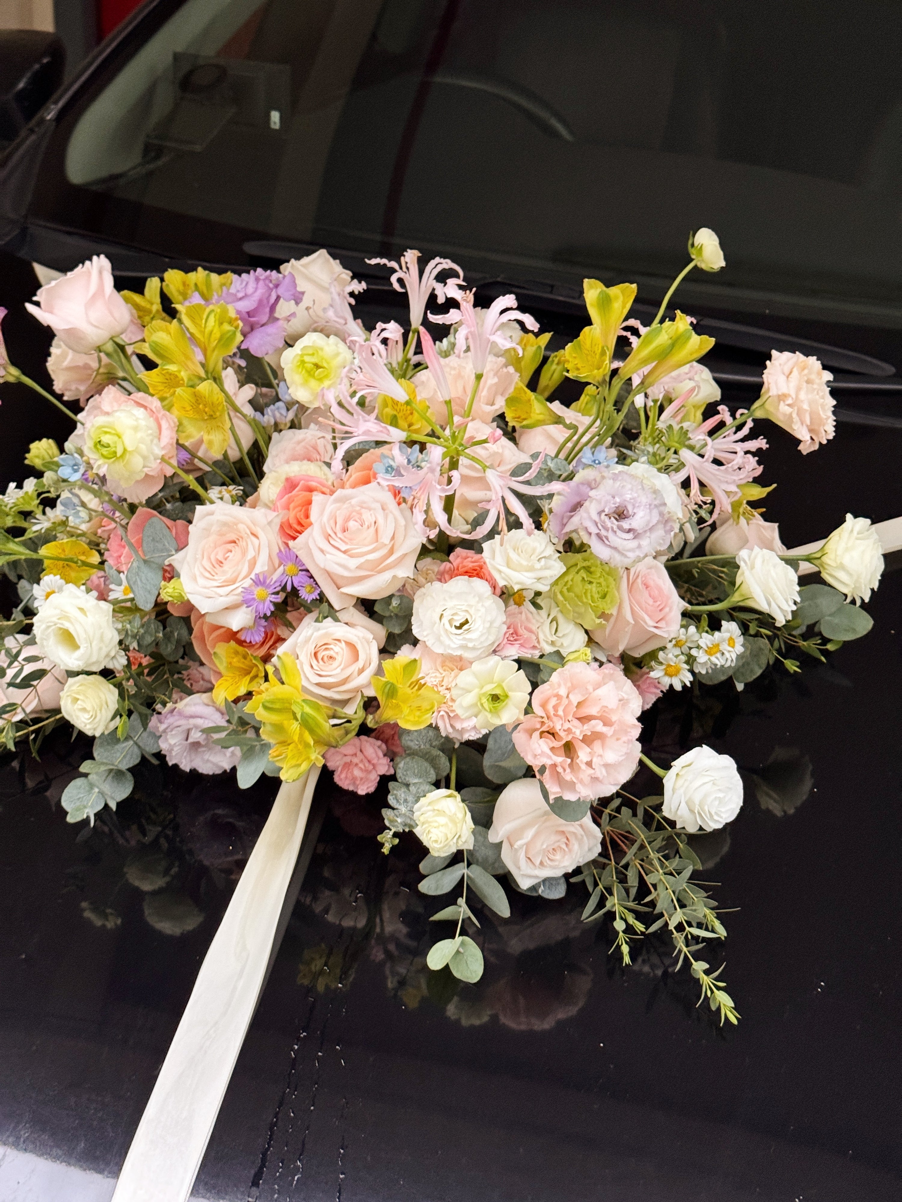Wedding bridal car decor, craffted with fresh flowers by Eden's Ground, a floral design boutique.