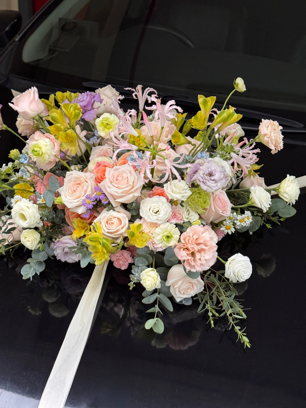Wedding bridal car decor, craffted with fresh flowers by Eden's Ground, a floral design boutique.
