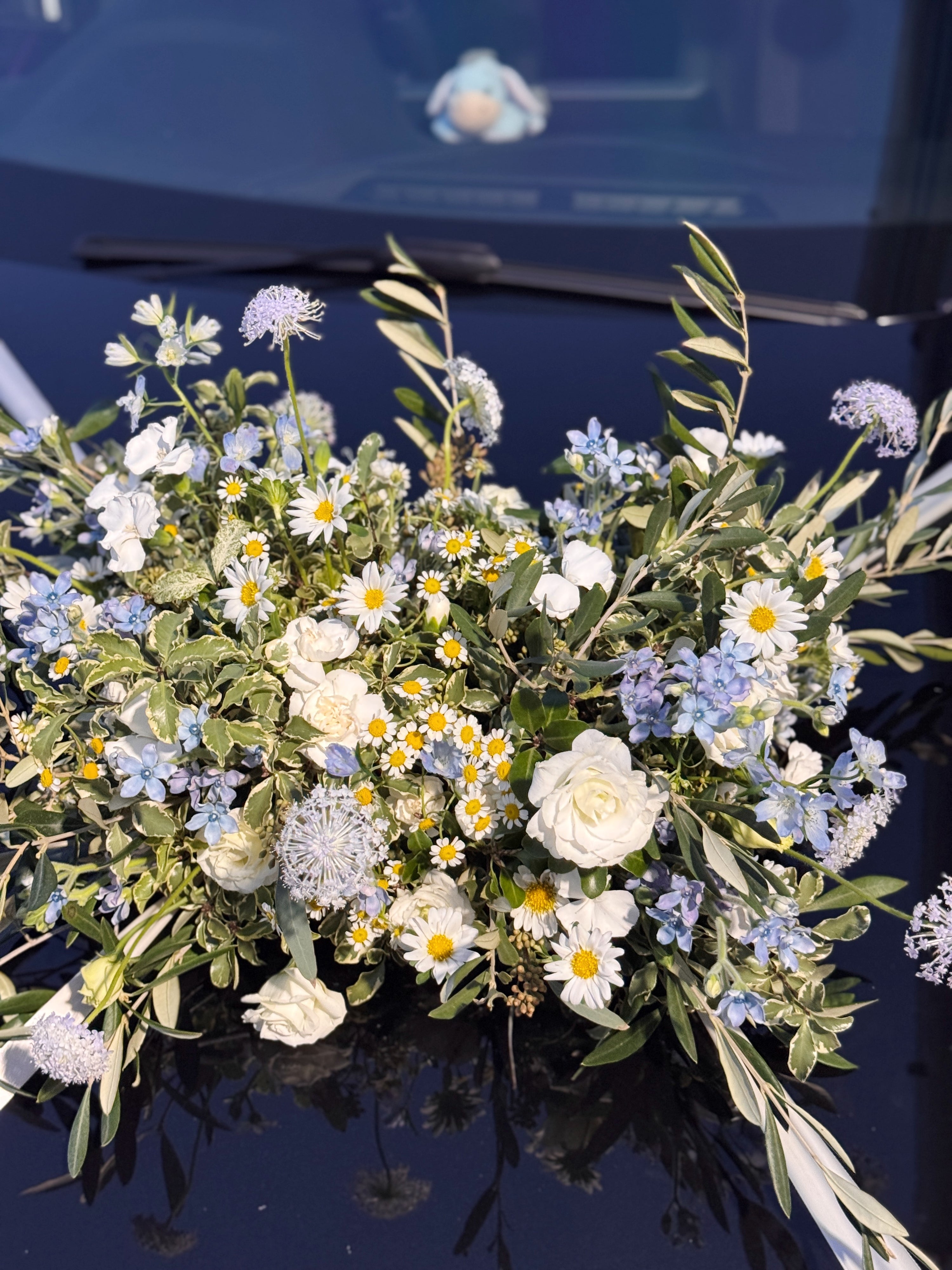 Wedding bridal car decor, craffted with fresh flowers by Eden's Ground, a floral design boutique.
