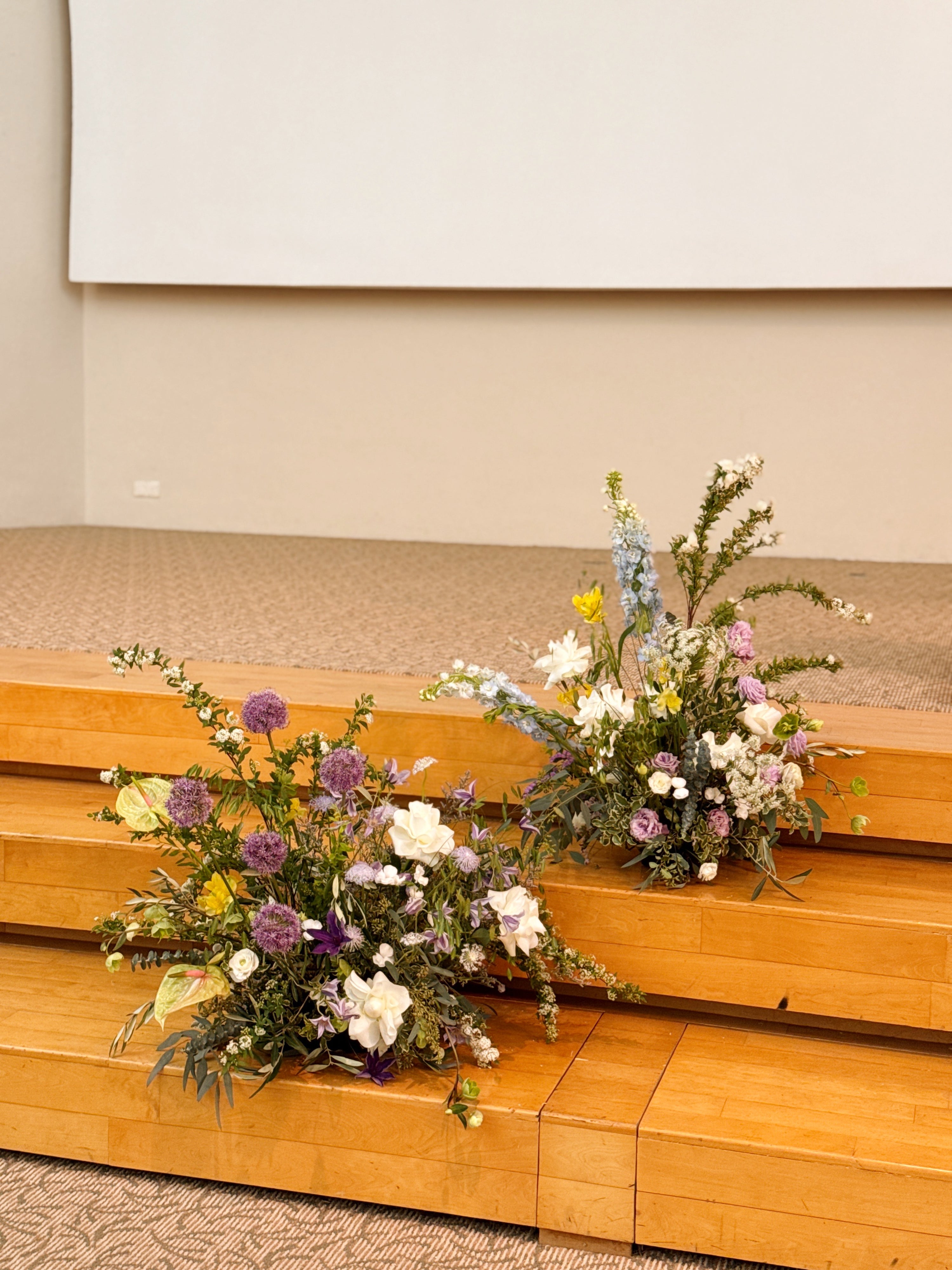 Wedding and events floral hedges, craffted with fresh flowers by Eden's Ground, a floral design boutique.