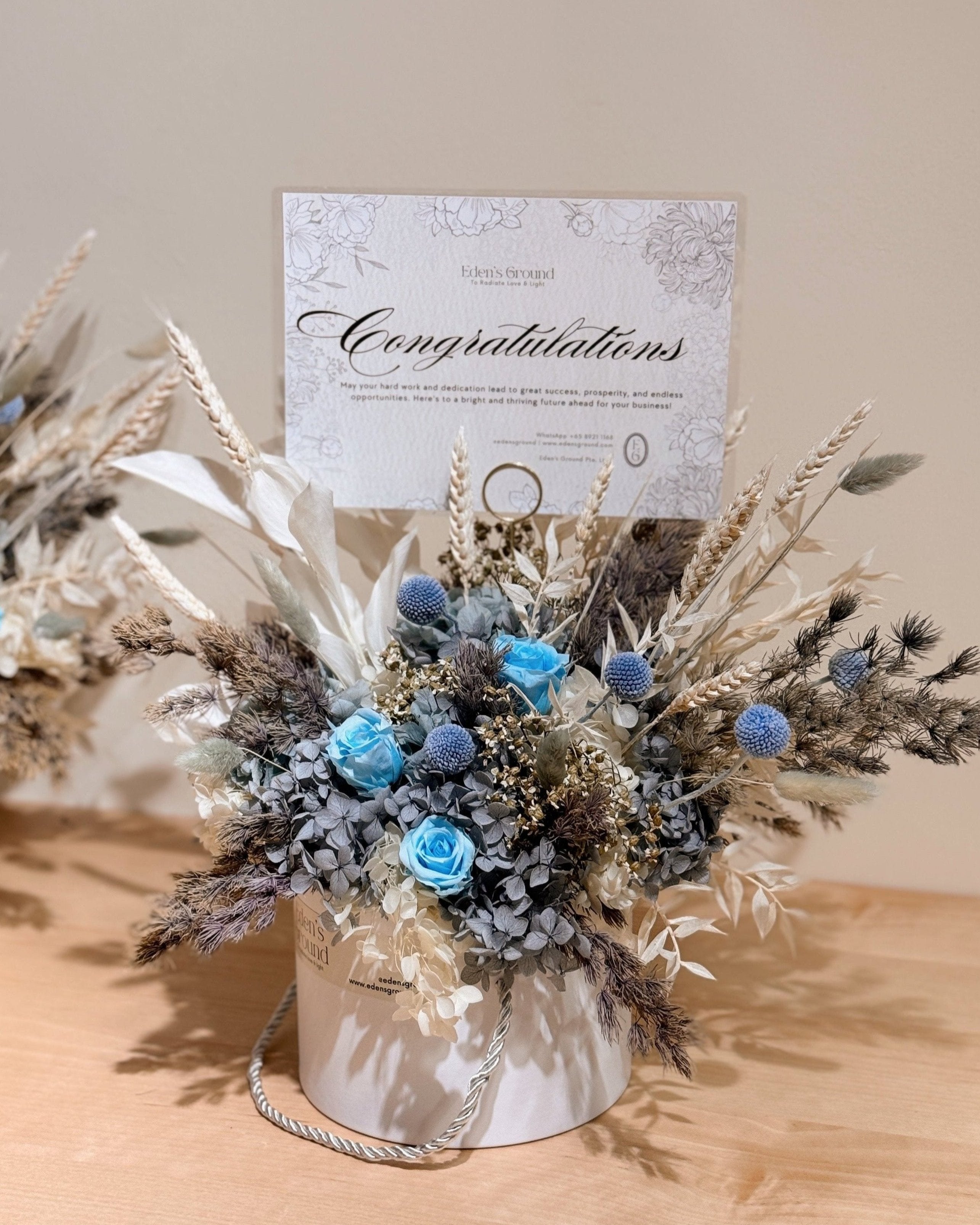 Congratulatory everlasting preserved flower bloom box arrangement crafted by Eden's Ground.
